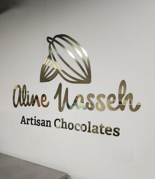 Wallmounted gold mirrored sign